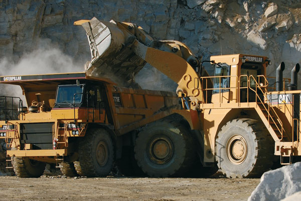 Cat Wheel Loader Dumping Aggregate in Cat Articulated Truck