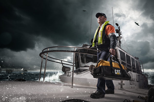 Cat Marine Technician On Boat in Storm