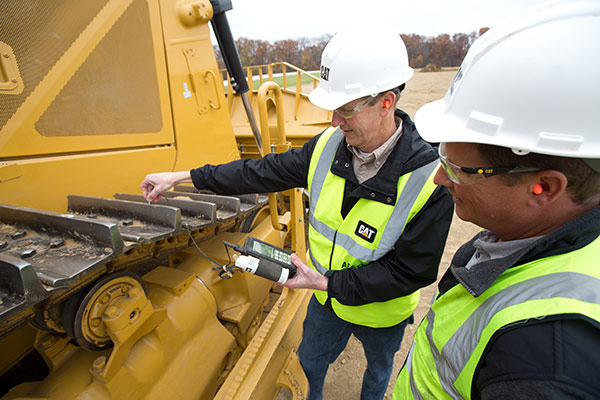 Yancey Technicians Inspecting Equipment Tracks