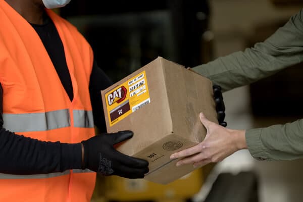 Cat Employee handing Cat Parts to Customer